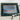 Raymarine E70723-03-WEU Axiom 2 9 RV fitted at a helm, rain drops on the screen showing depth 2.7 and the time