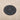 Scanstrut ROKK SC-CW-02F wireless charger, black honeycomb-pattern disc fitted flush in a wood surface, top view