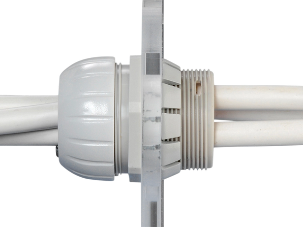 Scanstrut TBH-4 through bulkhead cable seal with several grey cables passing through a white bulkhead