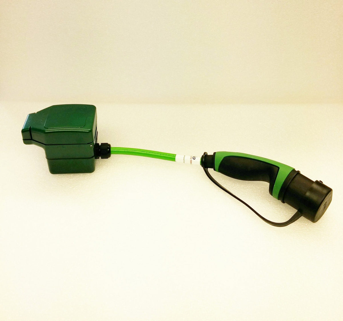 Mode 2 charging cable adapter, 31205, short green lead with a Type 2 male plug and a green domestic-style socket box