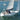 Sailing yacht under way with sails up and a radar scanner on a self levelling pole mount at the stern