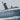 Powerboat at speed with a black aft-leaning Scanstrut APT-150-01-BLK PowerTower carrying a radome above the helm