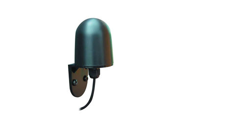 Raymarine T909 compass transducer, dark teal domed sensor on a black bracket with a short cable