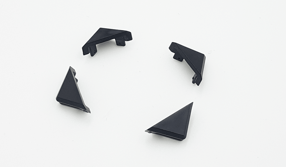Navico 000-15822-001 Zeus S corner clip accessory, four black triangular corner clips scattered on white