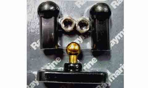 Raymarine D143 rudder reference ball joint kit, brass ball pin, two black sockets and nuts on a branded mat