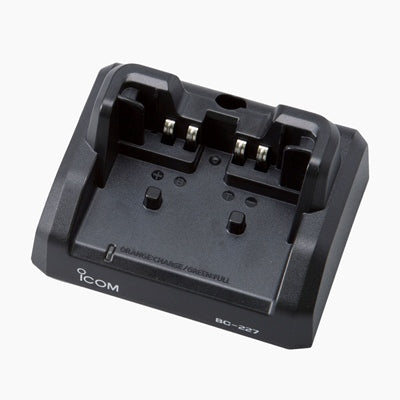 Icom BC-227 compact type desktop charger, dark grey two-slot cradle with the Icom logo