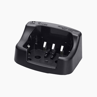 Icom BC-173 desktop charger, black cradle with charging slots and printed label, angled front view