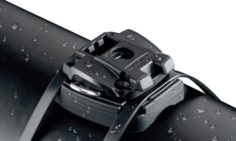 ROKK Mini RLS-403 cable tie base clamped to a black tube with a cable tie, close-up with water droplets