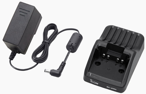 Icom BC-219N desktop charger, black cradle printed BC-219N with a black mains adapter and a lead with a right-angle plug