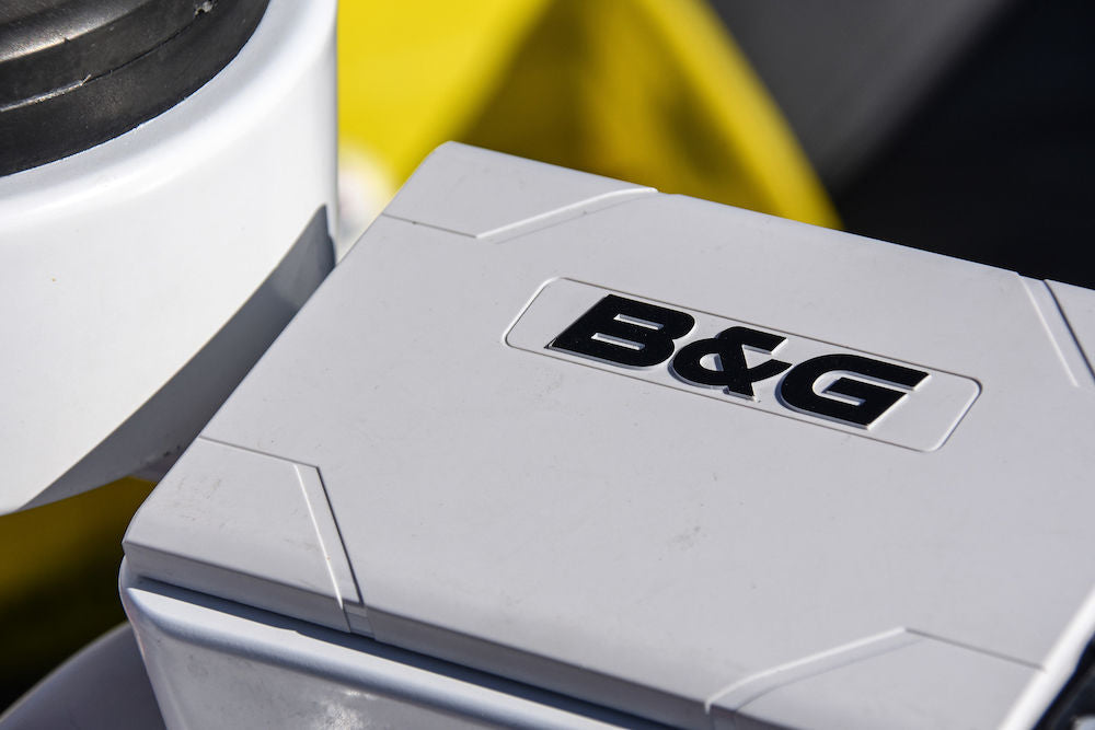 B&G 000-12892-001 sun cover for H5000 displays, grey-white padded cover with B&G lettering fitted on a boat