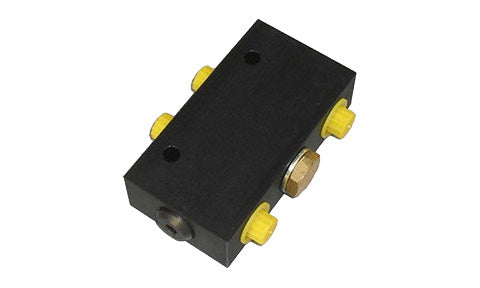 Raymarine M81166 hydraulic D.P. check valve, black block with yellow caps and brass fittings, angled view