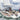 Sailing yacht under way with a radar on a Scanstrut SC102 style pole at the stern, crew at the helm