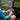 Garmin ECHOMAP Ultra 2 162sv 010-03385-00 in use at a boat helm, angler holding a phone beside sonar screens