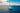 A yacht under way on open blue water